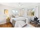 Comfortable bedroom with modern decor, natural light, and hardwood floors at 1180 S Honey Way, Denver, CO 80224
