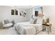 Comfortable bedroom with modern decor, natural light, and stylish furnishings at 1180 S Honey Way, Denver, CO 80224