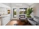 Cozy sitting area with a view of the backyard, hardwood floors, and contemporary furnishings at 1180 S Honey Way, Denver, CO 80224