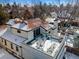 Aerial view of a home with a rooftop patio, surrounded by a snowy landscape at 229 Albion St, Denver, CO 80220