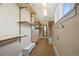Walk-in closet with custom shelving and rods for storage and organization at 229 Albion St, Denver, CO 80220