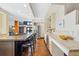 Spacious kitchen with stainless steel appliances, eat-in island, and hardwood floors at 229 Albion St, Denver, CO 80220