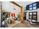 Open concept living room has a fireplace, high ceilings, and an adjacent dining area at 229 Albion St, Denver, CO 80220