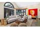 Stylish living room boasts a vaulted ceiling, lots of natural light, and modern furnishings at 229 Albion St, Denver, CO 80220