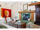 Relaxing living room with a fireplace, a neutral color palette, and stylish decor at 229 Albion St, Denver, CO 80220