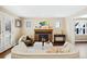 Bright living room featuring fireplace, hardwood floors, and lots of natural light at 229 Albion St, Denver, CO 80220