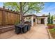 Entertain outdoors with this barbecue area and pergola-covered dining space at 229 Albion St, Denver, CO 80220