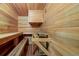Aromatic cedar sauna with wooden benches and stove at 229 Albion St, Denver, CO 80220