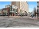 A bustling street corner showing shops and restaurants in a vibrant neighborhood at 229 Albion St, Denver, CO 80220
