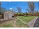 Large backyard featuring a shed, rock garden, and mature trees at 6676 S Kit Carson St, Centennial, CO 80121