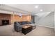 Cozy basement featuring a brick fireplace and ample built-in storage at 6676 S Kit Carson St, Centennial, CO 80121