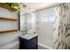 Charming bathroom with subway tile, stylish vanity, and wood shelving at 6676 S Kit Carson St, Centennial, CO 80121