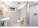 Clean bathroom features a pedestal sink and a stand-up shower at 6676 S Kit Carson St, Centennial, CO 80121