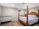 Bedroom featuring a wooden four poster bed and decorative dresser at 6676 S Kit Carson St, Centennial, CO 80121