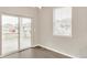Bright dining area with sliding glass doors and large window, offers lots of light at 1144 Ridgefield Dr, Berthoud, CO 80513