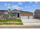 Beautifully landscaped single-story home with a cozy front porch and two-car garage at 1144 Ridgefield Dr, Berthoud, CO 80513