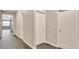 Hallway with modern doors, wood floors and fresh paint at 1144 Ridgefield Dr, Berthoud, CO 80513