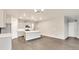 Spacious kitchen with modern gray cabinets, an island, and stainless steel appliances at 1144 Ridgefield Dr, Berthoud, CO 80513