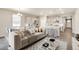 Open-concept living area with a modern kitchen, dining space, and stylish decor at 1144 Ridgefield Dr, Berthoud, CO 80513