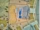 Aerial view highlighting the property's roof, solar panels, backyard, and surrounding landscape at 16272 W 95Th Ln, Arvada, CO 80007