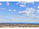 Stunning aerial view showcasing the city skyline beyond the neighborhood at 16272 W 95Th Ln, Arvada, CO 80007