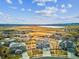Aerial view of the property showcasing a lakeside community with spacious lots and stylish homes at 16272 W 95Th Ln, Arvada, CO 80007
