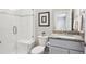 Modern bathroom with a glass shower, a marbled countertop, and neutral colors at 16272 W 95Th Ln, Arvada, CO 80007