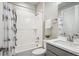 Bright bathroom features a shower and tub combination with white subway tile and modern fixtures at 16272 W 95Th Ln, Arvada, CO 80007