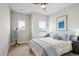 Bedroom showcases a calm aesthetic, with natural light and tasteful decor at 16272 W 95Th Ln, Arvada, CO 80007