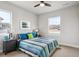 Bright bedroom features a comfortable queen bed, and side tables with lamps at 16272 W 95Th Ln, Arvada, CO 80007