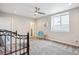 Well-lit bedroom with a ceiling fan, neutral colors, and ample closet space at 16272 W 95Th Ln, Arvada, CO 80007