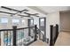 Elegant foyer featuring dark wood coffered ceiling and staircase at 16272 W 95Th Ln, Arvada, CO 80007