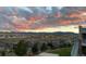 Stunning sunset view from the backyard of the property at 16272 W 95Th Ln, Arvada, CO 80007