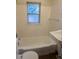 Classic bathroom with white tile, a standard bathtub, and a pedestal sink at 4209 Perry St, Denver, CO 80212
