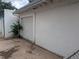 Garage exterior with white cinderblock and a white door at 4209 Perry St, Denver, CO 80212