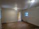 Spacious living room with hardwood floors, natural light, and a view into adjoining rooms at 4209 Perry St, Denver, CO 80212