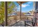 Covered porch with wood bench, overlooking the neighborhood at 14449 E 101St Pl, Commerce City, CO 80022