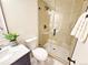 Modern bathroom featuring a glass-enclosed shower with stylish tile, a marble countertop and contemporary fixtures at 6330 E Irwin Pl, Centennial, CO 80112