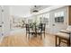 Bright dining area with a glass table, pendant light, and a view into the living room, perfect for gatherings at 6330 E Irwin Pl, Centennial, CO 80112