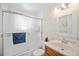 Clean bathroom with a shower/tub combo and vanity at 1859 S Saulsbury Ct, Lakewood, CO 80232