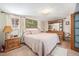 Comfortable main bedroom with dresser and ensuite access at 1859 S Saulsbury Ct, Lakewood, CO 80232