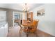 Cozy dining area with a round table and chairs, access to a sunroom at 1859 S Saulsbury Ct, Lakewood, CO 80232