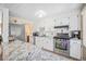 Bright kitchen with granite countertops and stainless steel appliances at 1859 S Saulsbury Ct, Lakewood, CO 80232