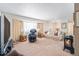 Bright living room featuring a fireplace, large window, and comfortable furniture at 1859 S Saulsbury Ct, Lakewood, CO 80232