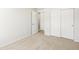 Bedroom showing closet with sliding doors and neutral carpet at 22360 E 8Th Ave, Aurora, CO 80018