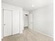 Bedroom featuring closet with sliding doors and neutral carpet at 22360 E 8Th Ave, Aurora, CO 80018