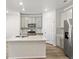 Bright, modern kitchen featuring gray cabinets, stainless steel appliances, and a spacious island at 22360 E 8Th Ave, Aurora, CO 80018