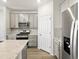 Modern kitchen with stainless steel appliances, gray cabinets, and granite countertops at 22360 E 8Th Ave, Aurora, CO 80018