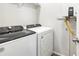 Laundry room features a Whirlpool washer and dryer at 22360 E 8Th Ave, Aurora, CO 80018