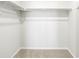 A walk-in closet includes carpeted floor and a hanging clothes bar at 22360 E 8Th Ave, Aurora, CO 80018